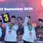 SJMRINGAH: Pasangan Cabup-Cawabup nomor urut tiga, RKH Muhammad Baqir Aminatullah - Tahfadi (BERBAKTI) junjung angka tiga saat pleno terbuka KPU Pamekasan. (IST/TELITI) 